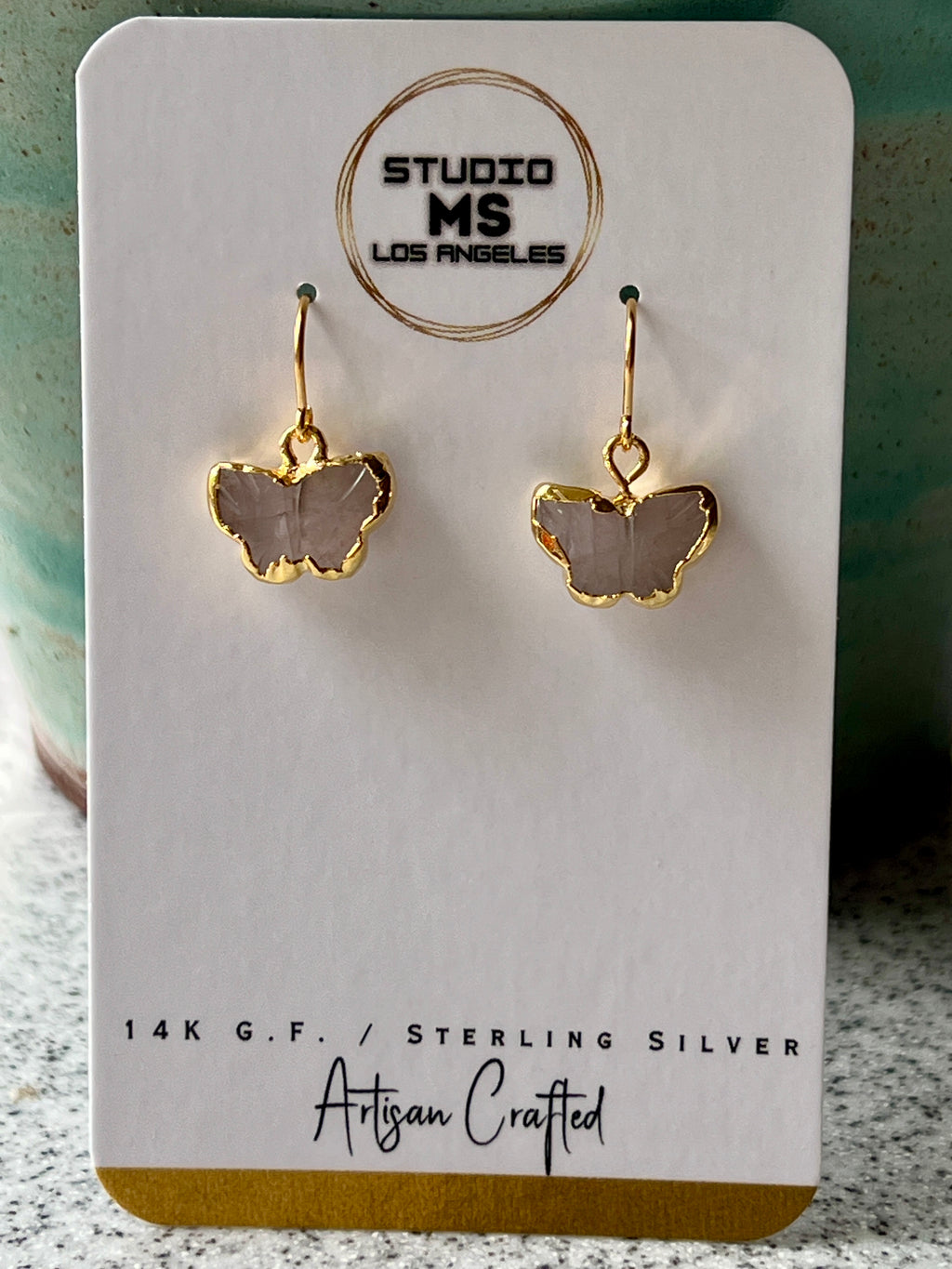 Rose quartz butterfly earrings on Studio MS Los Angeles earring card, labeled 14K GF artisan crafted, showing gold electroform butterflies