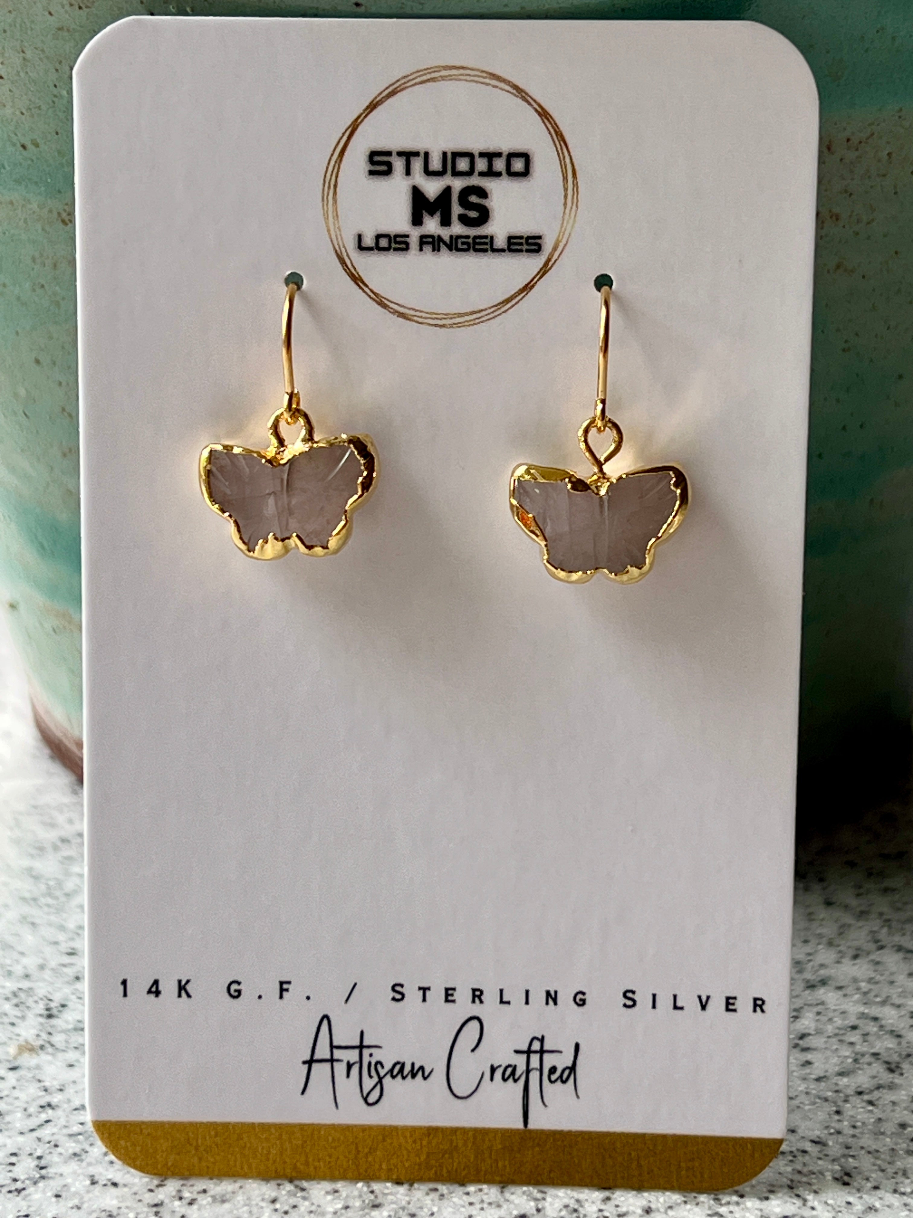 Rose quartz butterfly earrings on Studio MS Los Angeles earring card, labeled 14K GF artisan crafted, showing gold electroform butterflies
